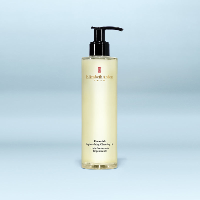 Elizabeth Arden cleansing oil bottle on a light blue background