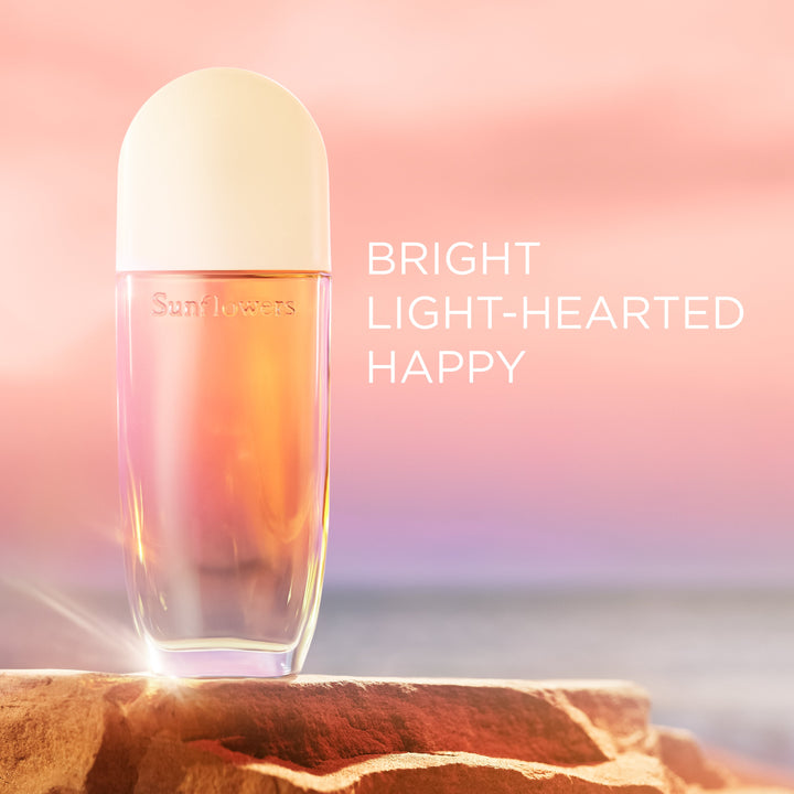 Perfume bottle with 'Sunflowers' branding on a pink and orange gradient background. Bright Light-hearted happy