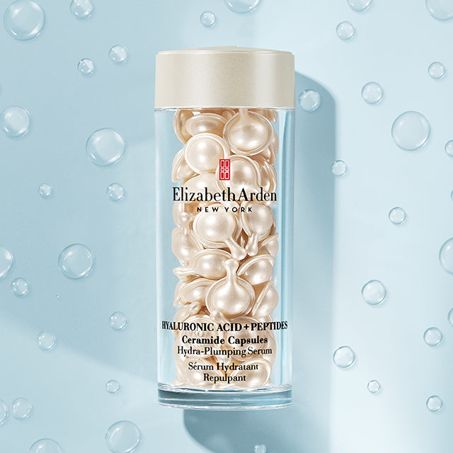 Hyaluronic Acid + Peptides Ceramide Capsules on a light blue background with water droplets