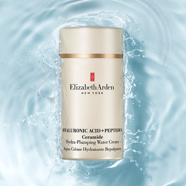 Hyaluronic Acid + Peptides Ceramide water cream bottle with water droplets on a light blue background