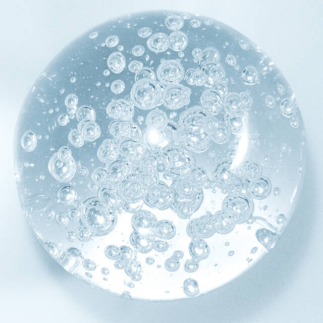 Exosomes ingredient-Clear gel with bubbles on a light blue background