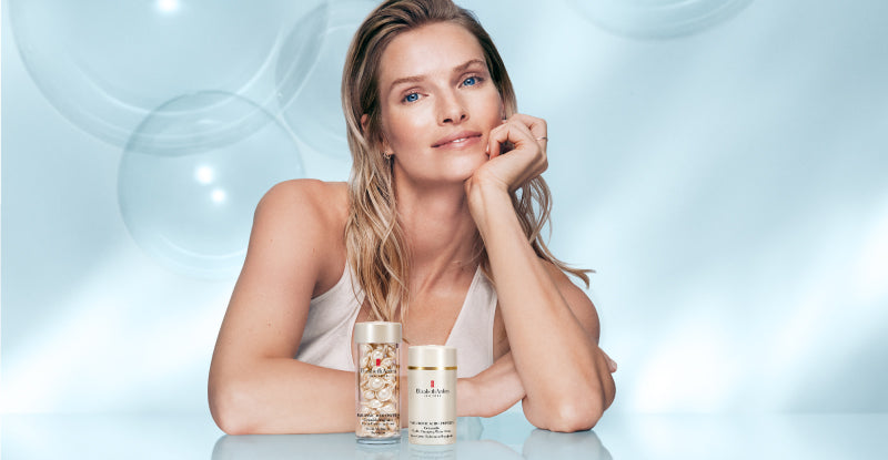 Woman (model) with new HA products, Capsules and Water Cream, on a light blue background