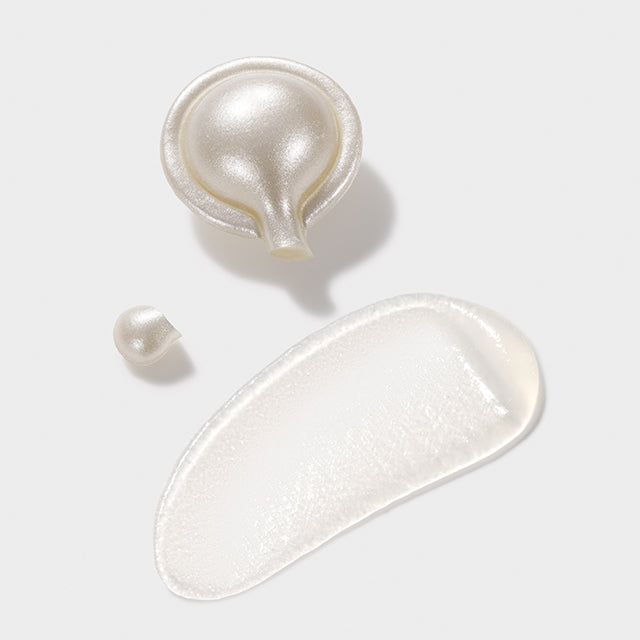Hyaluronic Acid + Peptides Ceramide Capsules opened with silky serum texture spread across on a light gray background